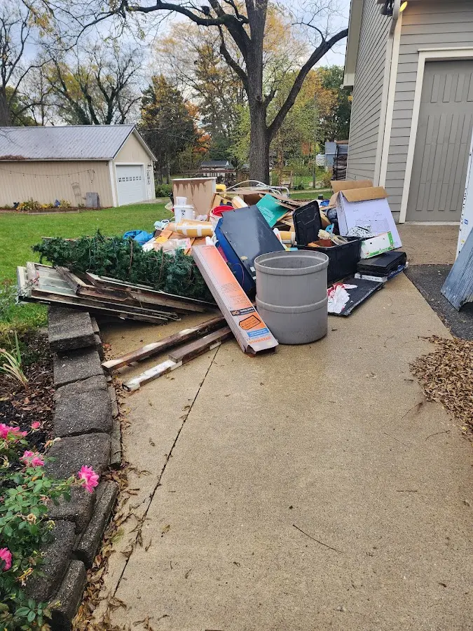 Dumpster being loaded with debris for Roofing Dumpster Rental in Yerington